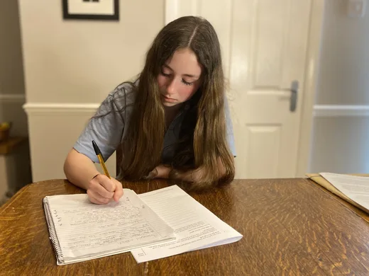 A student studying English with focused calm